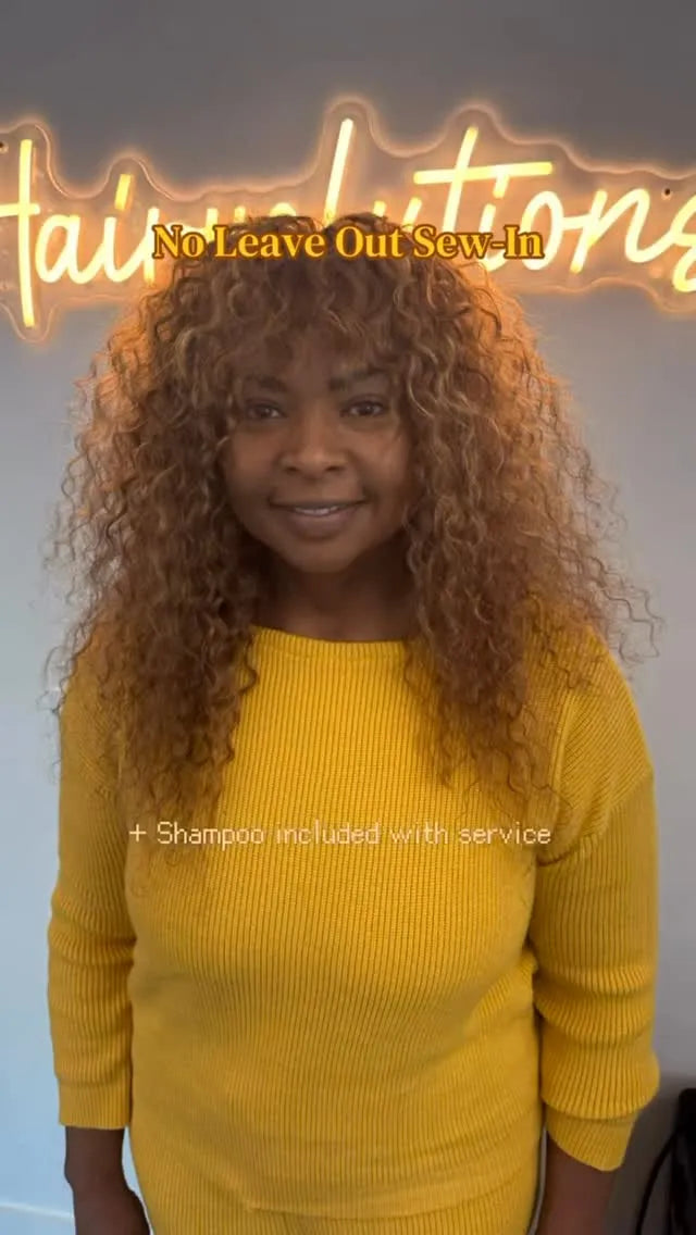 Voluminous curly no-leave-out sew-in with warm brown color, layered curls, and soft bangs, Stylist located in Gilbert, AZ
