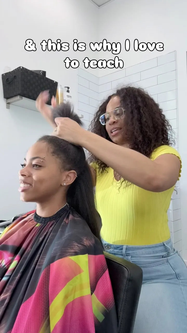 Long natural black hair being styled into a sleek straight hairstyle during a salon service, Stylist located in Gilbert, AZ