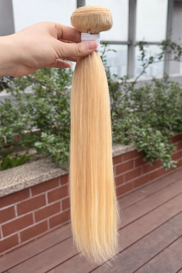 Outdoor picture of 613 blonde bundles double weft sew in extensions straight virgin hair