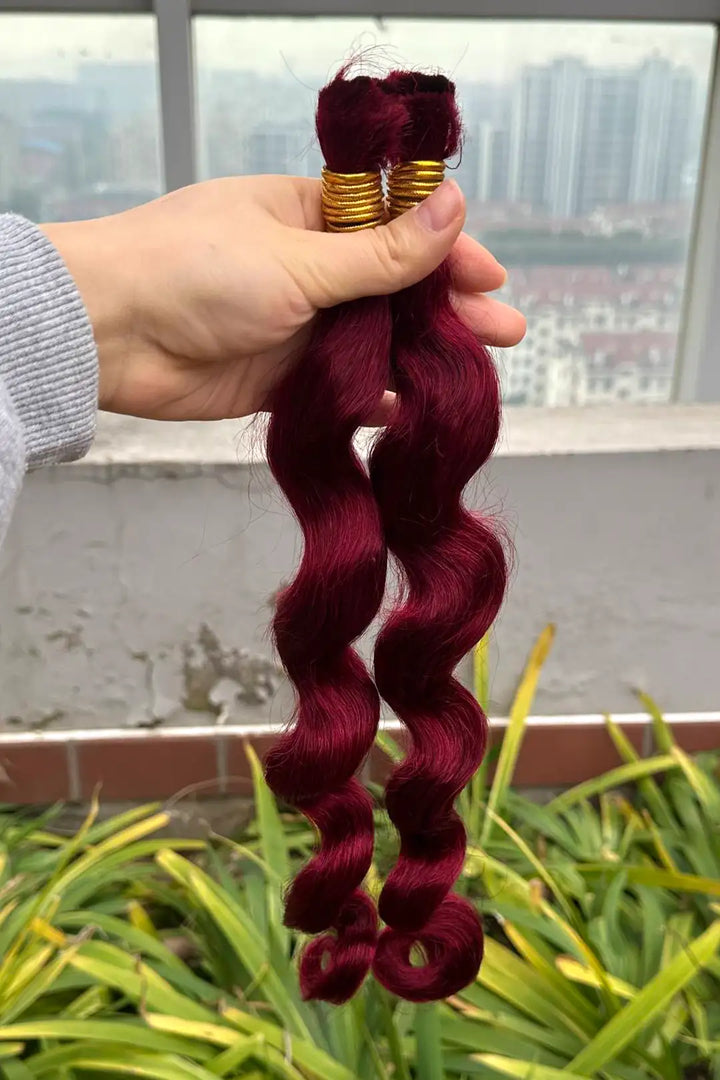Outdoor picture of burgundy 99j loose wave bulk human hair for braiding