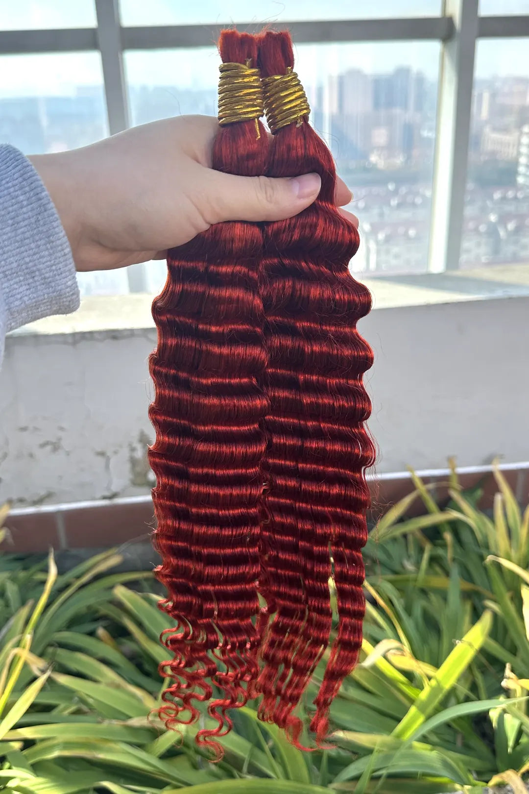 Outdoor picture of copper red deep wave bulk human hair for braiding bu23