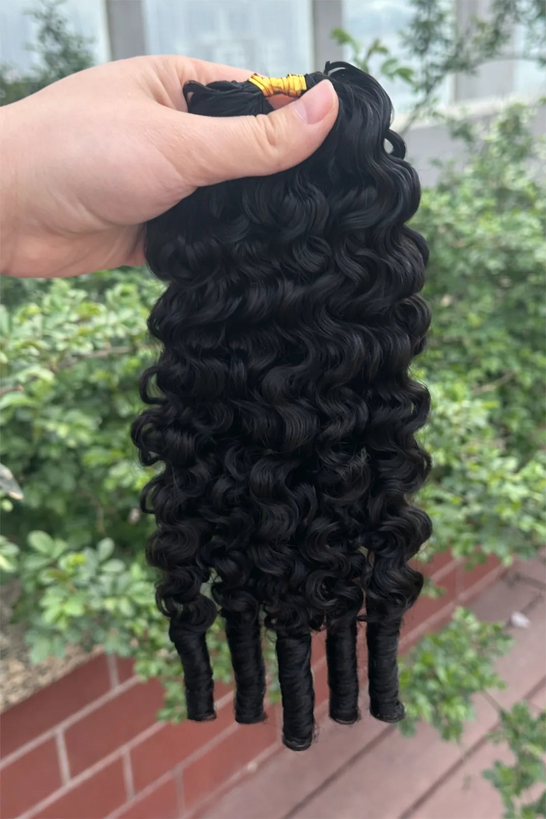 Outdoor picture of feather crochet hair extension burmese water curly human hair