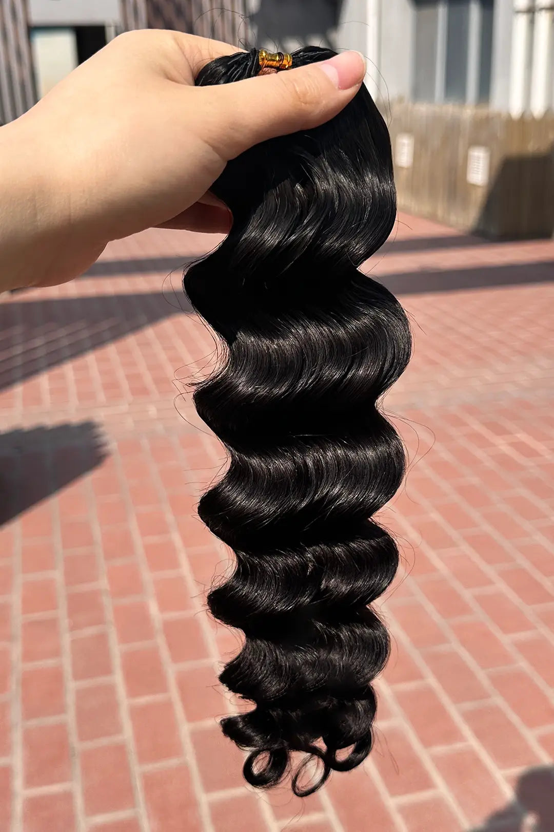 Outdoor picture of feather crochet hair extension loose wave human hair
