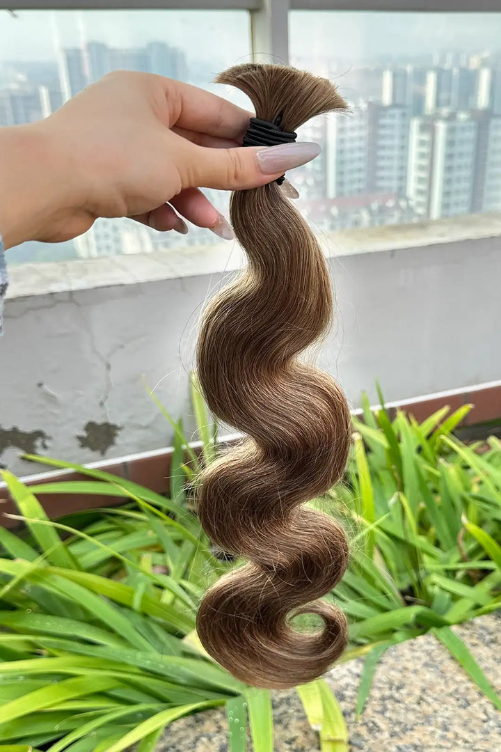 Outdoor picture of light blonde body wave bulk human hair