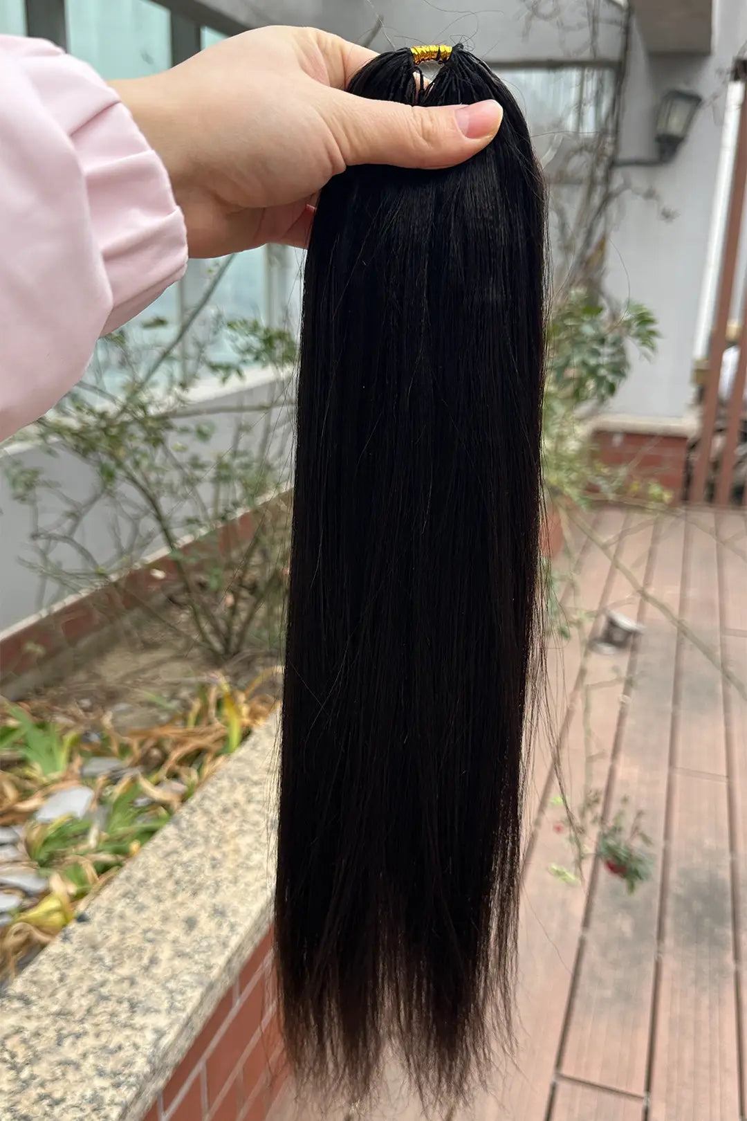 Outdoor picture of  light yaki straight feather crochet hair extension human hair