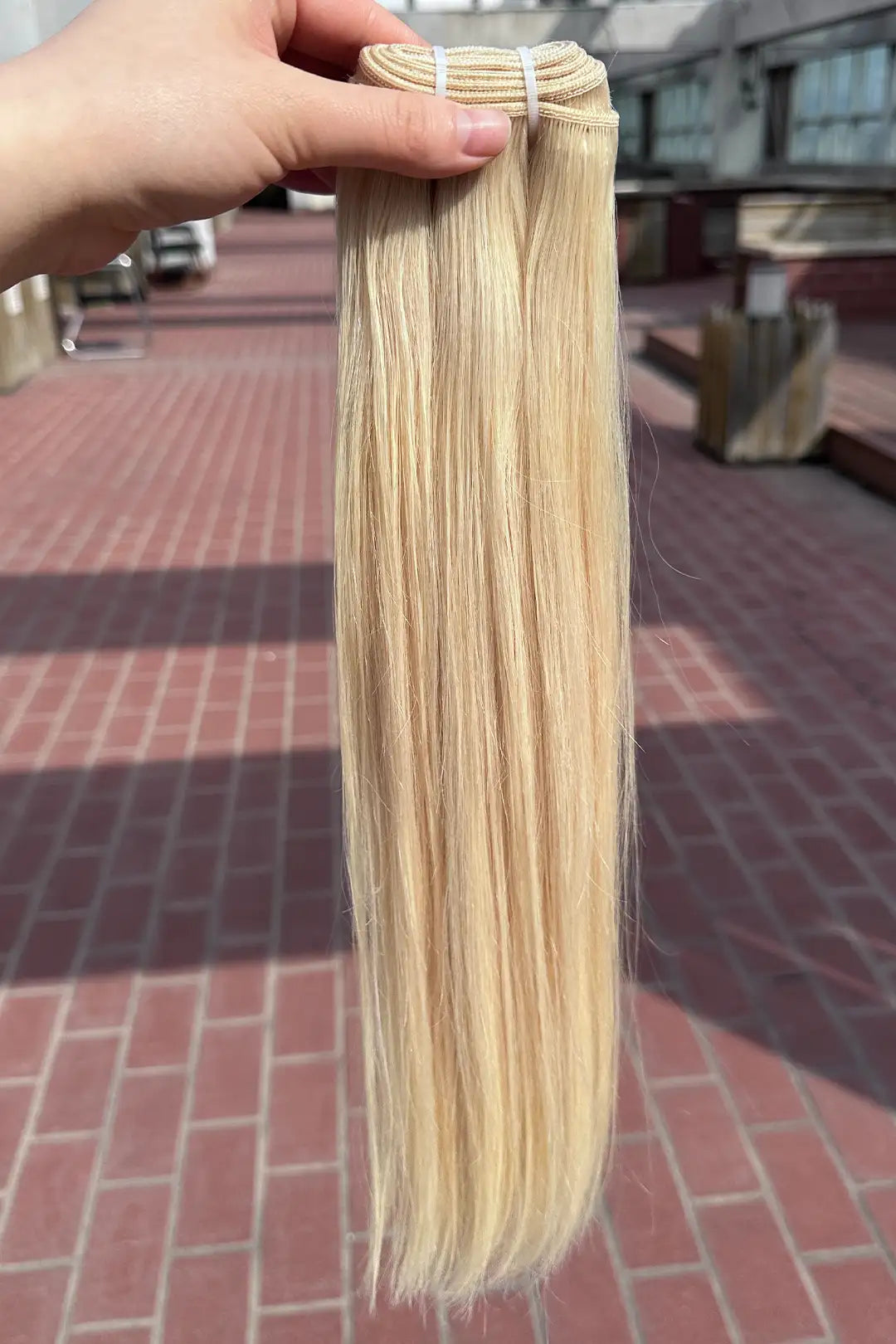 Outdoor picture of platinum blonde bundles #60a sew-in extensions straight virgin hair