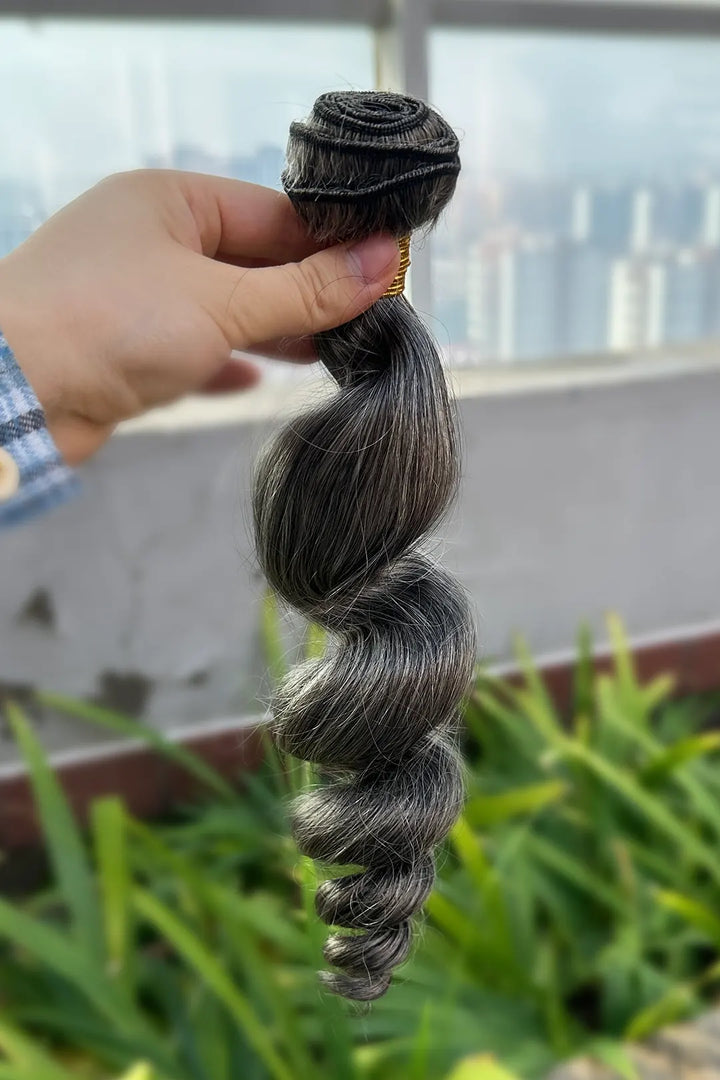 Outdoor picture of salt and pepper sew in extensions loose wave virgin hair 70 gray