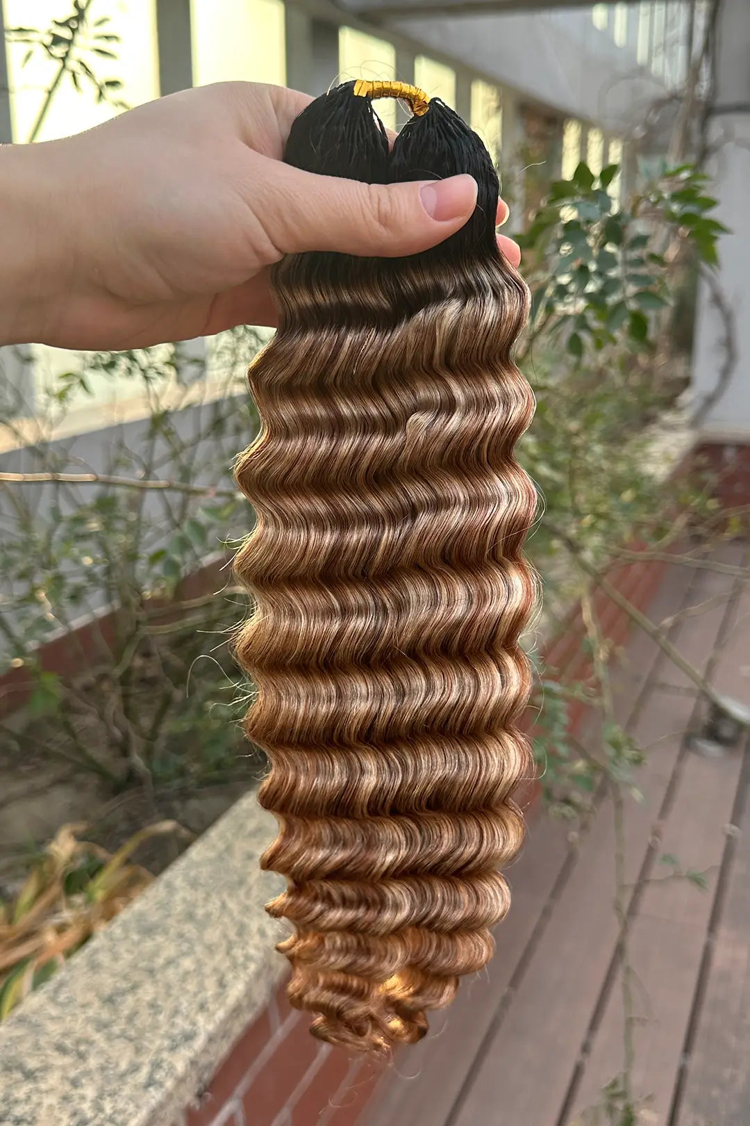 Outdoor picture of t natural black root mixed 27/30/613 deep wave feather crochet human hair