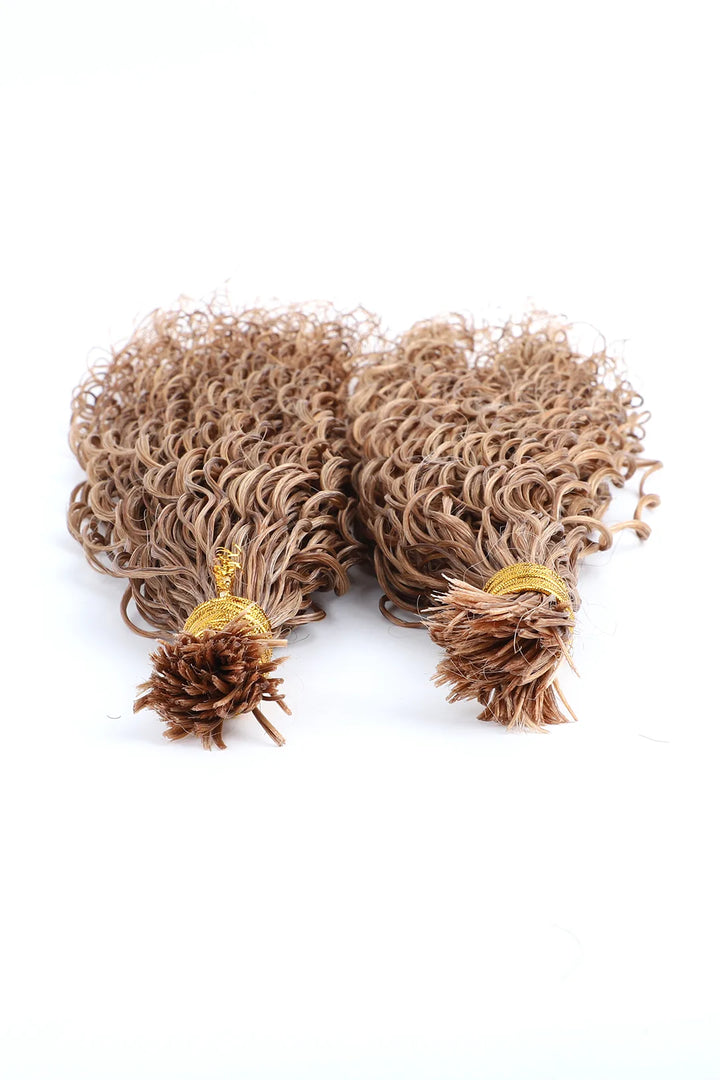 Two bundles of curly bulk hair in color 27# (light blonde), shown from a bottom-up angle. The hair is pre-divided, double-drawn, made of human hair, and designed for easy braiding, labeled as BU84. Each bundle is tied at the top with a gold band, displaying a tight, curly texture that fans out. The background is plain white.