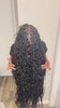 Tiktok influencer niquestouchceo shows the braiding process of deep wave braiding feather crochet hair