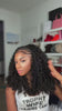 Tiktok influencer kaychelled shows the braiding process of burmese curly with spiral ends feather crochet hair extension