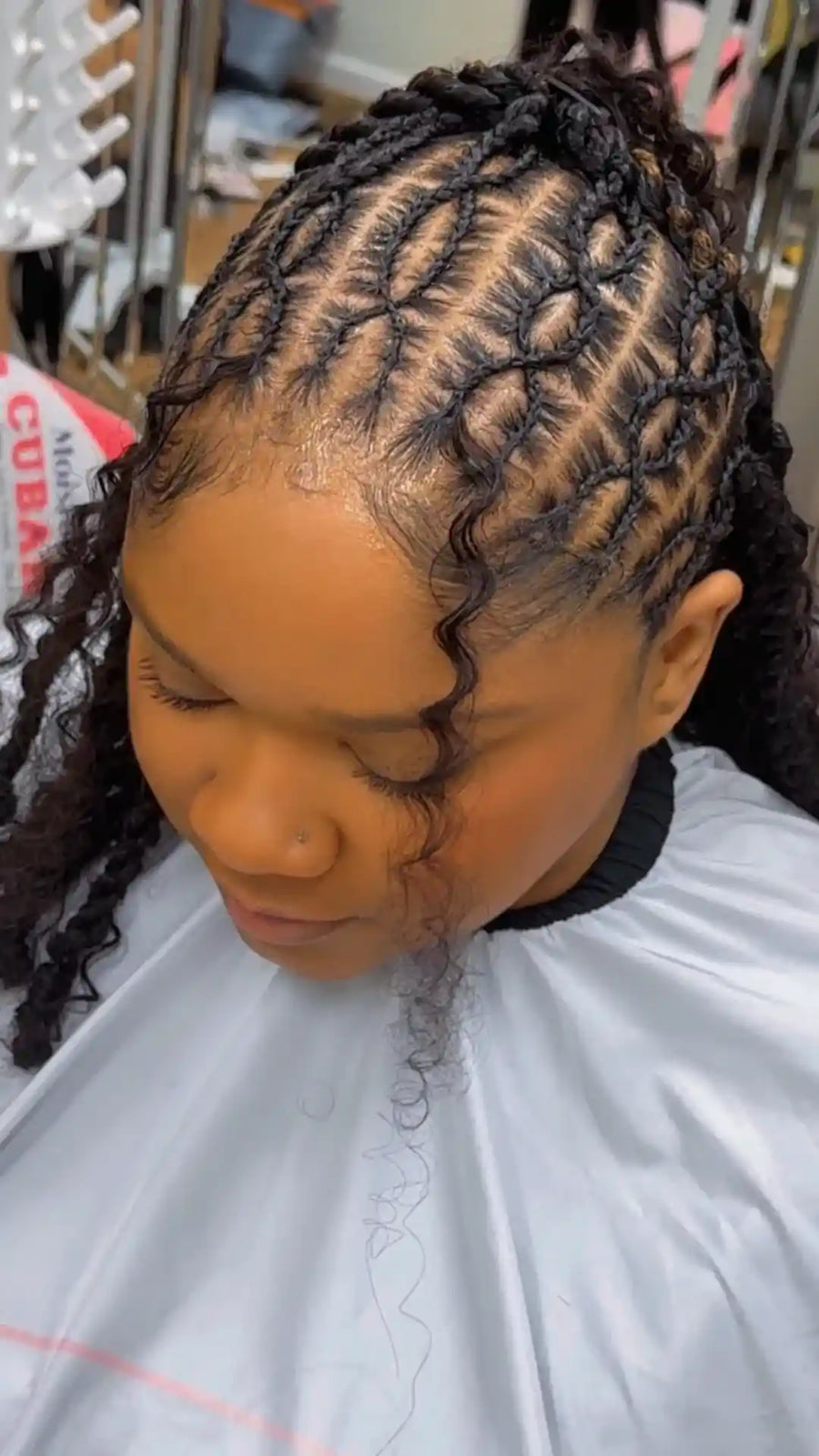 Feed-in braids with curly pieces and detailed parting, hairstylist in Durham, NC