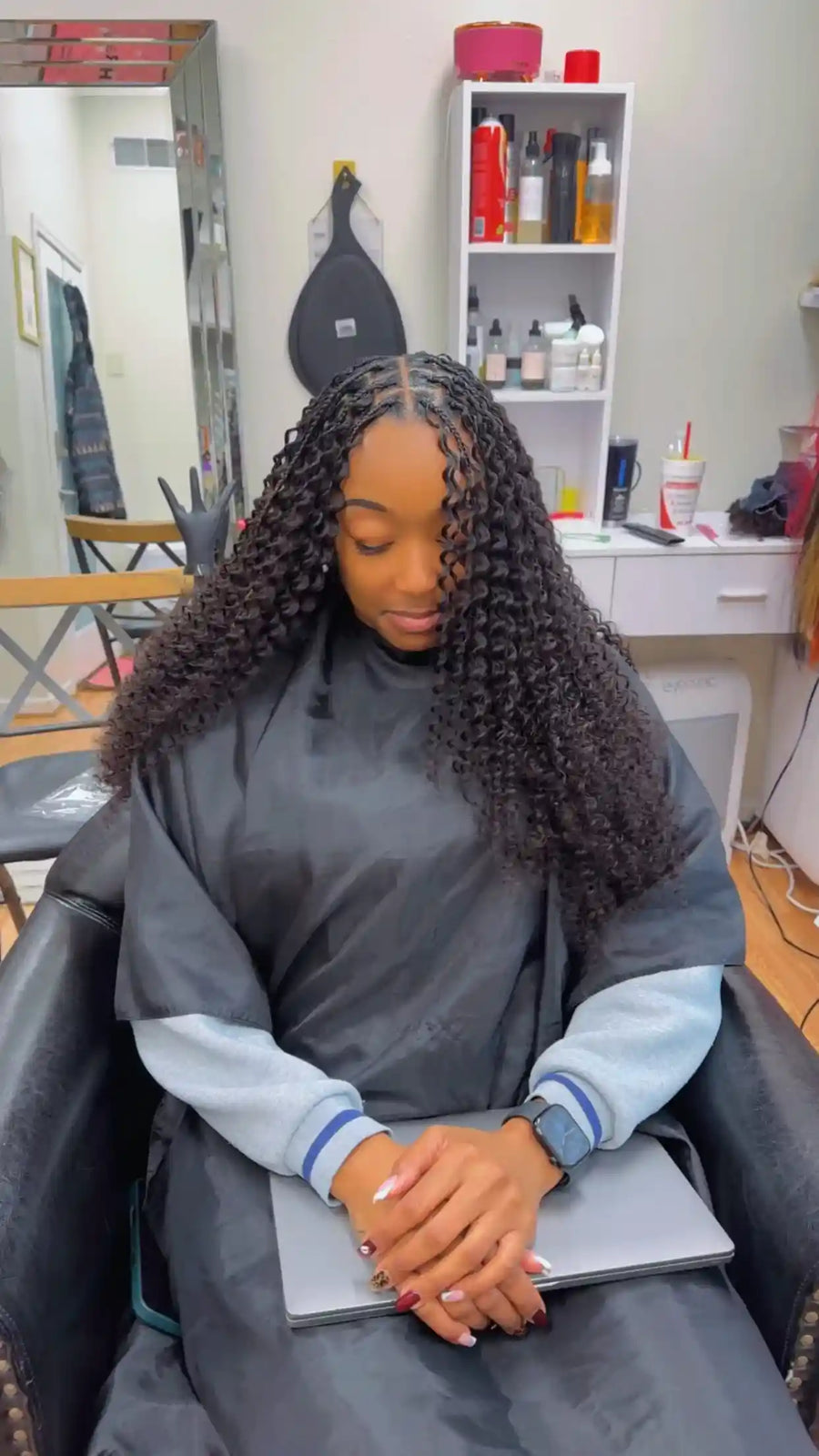Long curly crochet braids with middle part, hairstylist in Durham, NC
