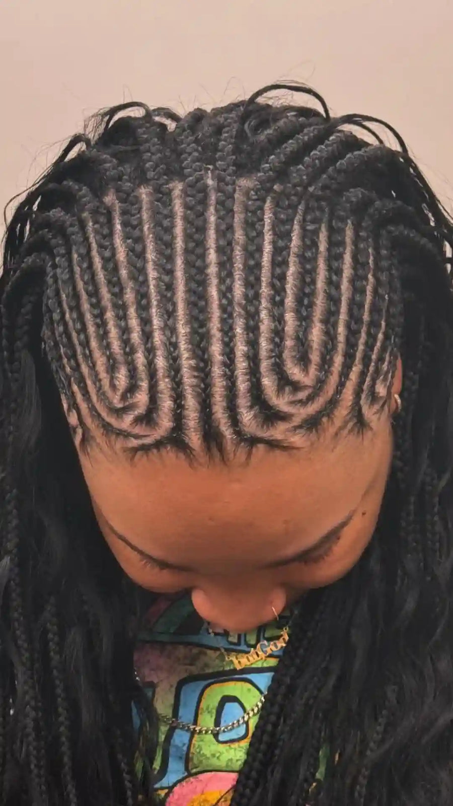 Curly braided hairstyle with side part, hairstylist in Durham, NC