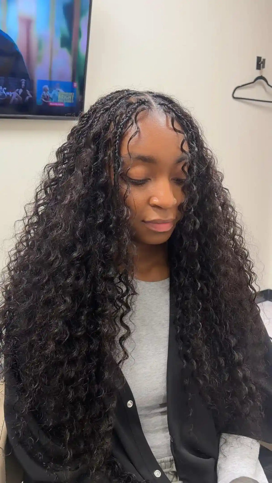 Long black boho braids with loose curls and face framing pieces, hairstylist in San Antonio, TX