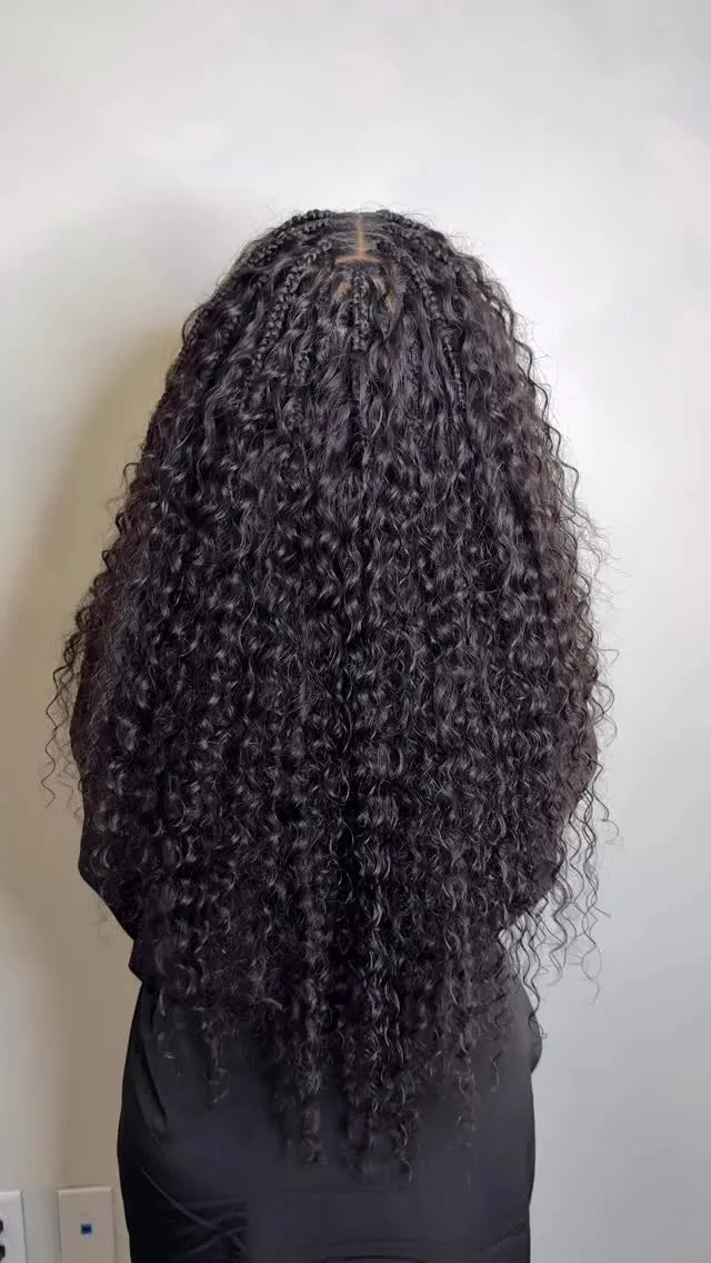 Long black curly boho braids with center part, hairstylist in San Antonio, TX