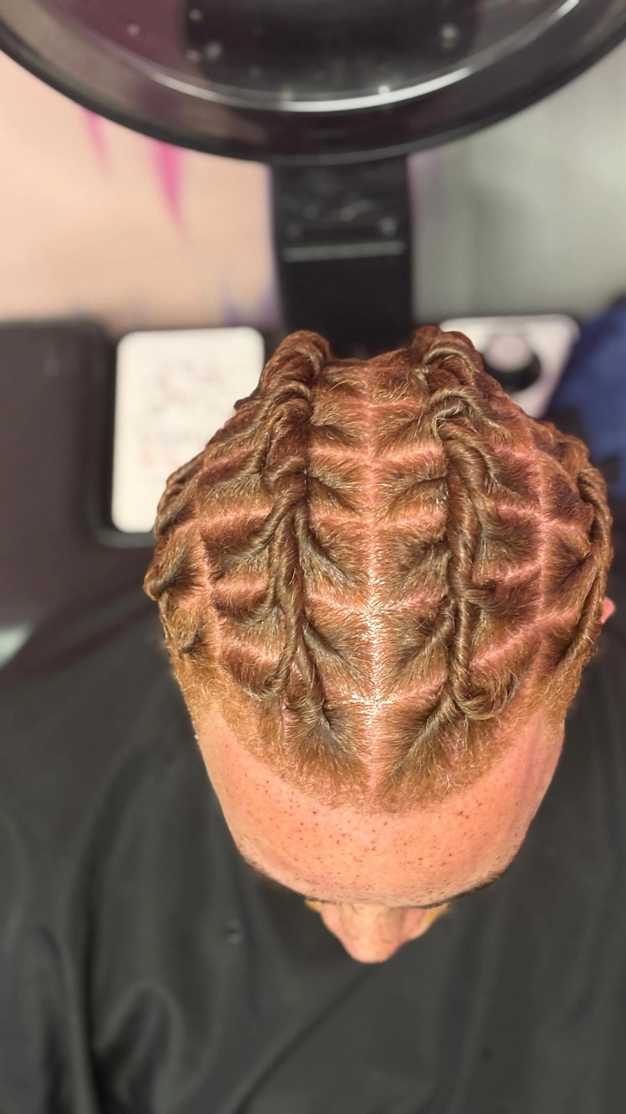Neat cornrow braid style with clean curved parting, hairstylist in Westland, MI