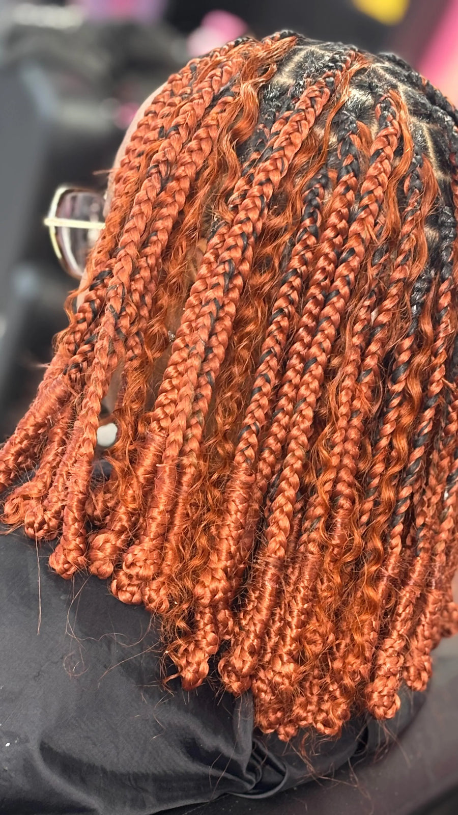 Copper boho braids with loose curly pieces, hairstylist in Westland, MI