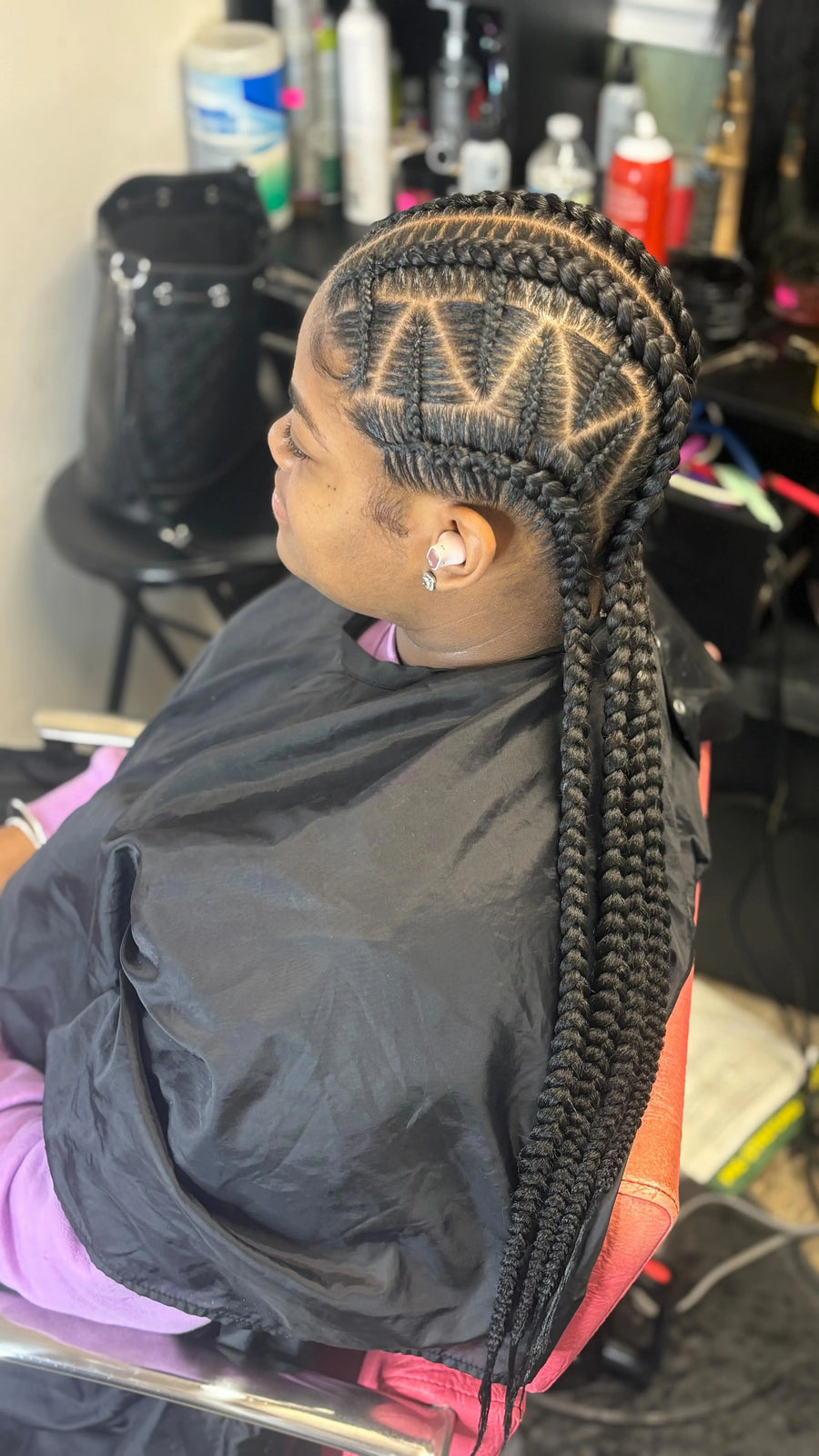 Large feed-in braids with triangle and zigzag part design, hairstylist in Westland, MI