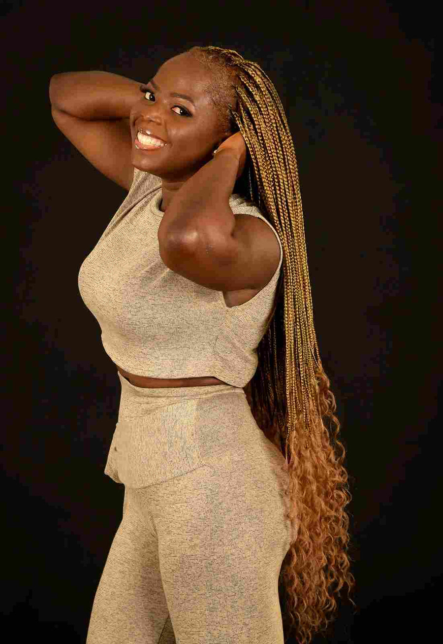Long honey blonde box braids with curly ends, hairstylist located in Round Rock, TX