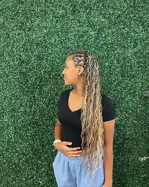 Long small knotless box braids with natural black color, hairstylist located in Round Rock, TX