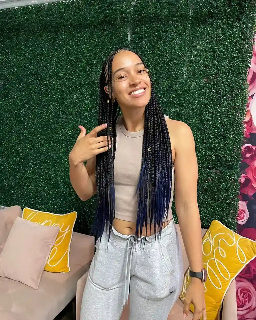 Long boho box braids with wavy human hair curls, hairstylist located in Round Rock, TX