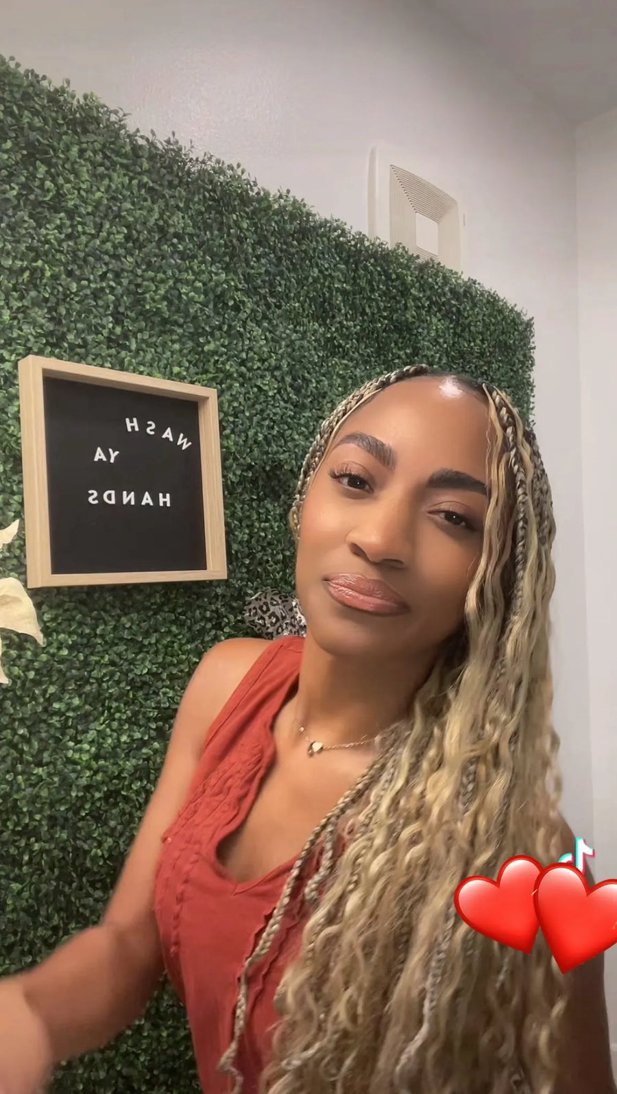 Long blonde boho knotless braids with loose waves and face-framing curls, hairstylist located in Arlington, TX