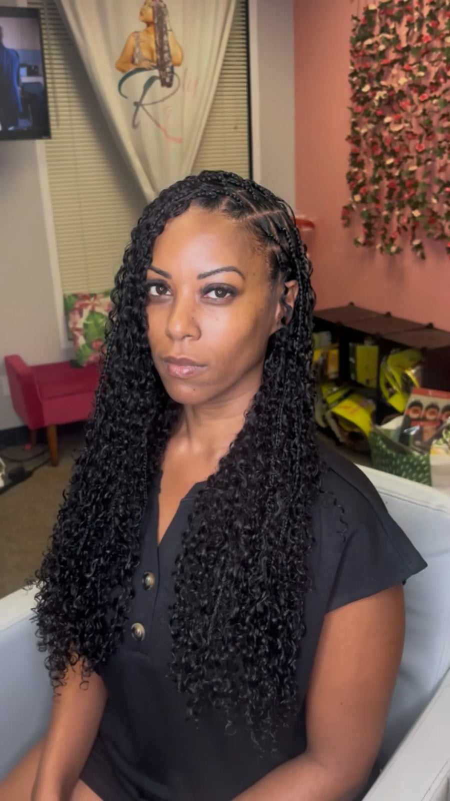Side-parted boho knotless braids with long black curls, hairstylist located in Arlington, TX
