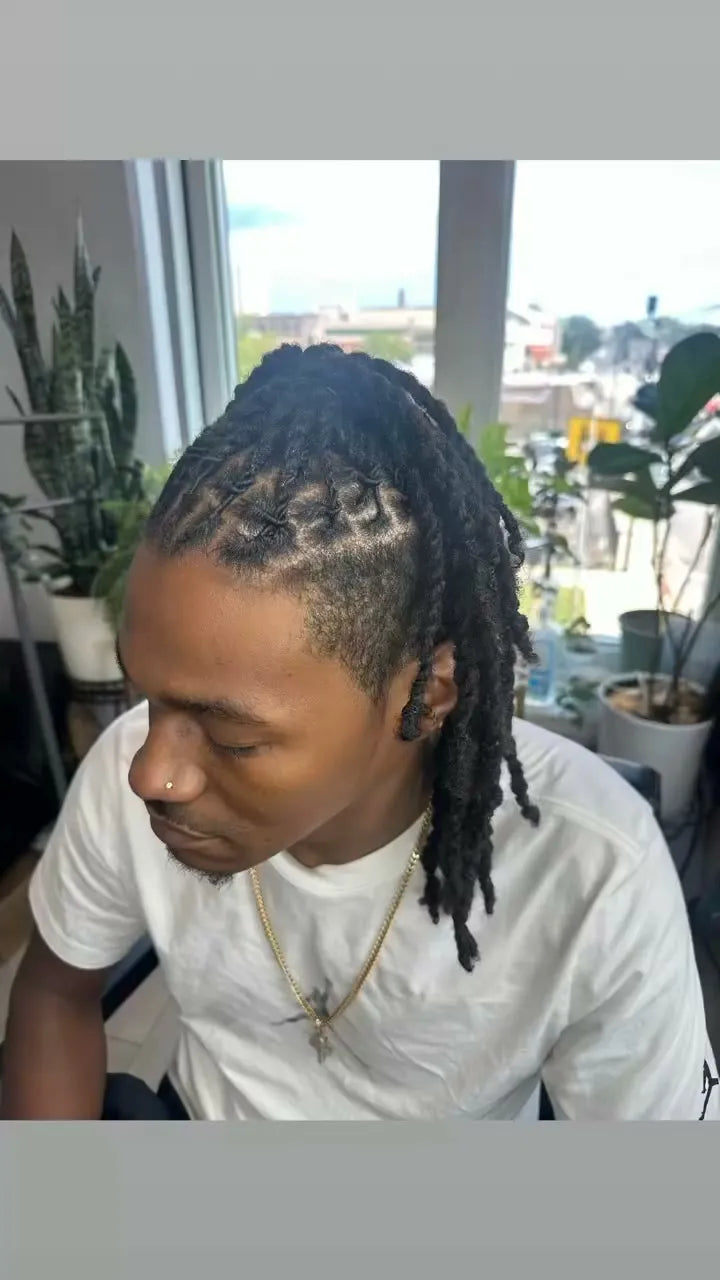 Men’s braided loc style with clean scalp parting, Stylist located in Chicago, IL