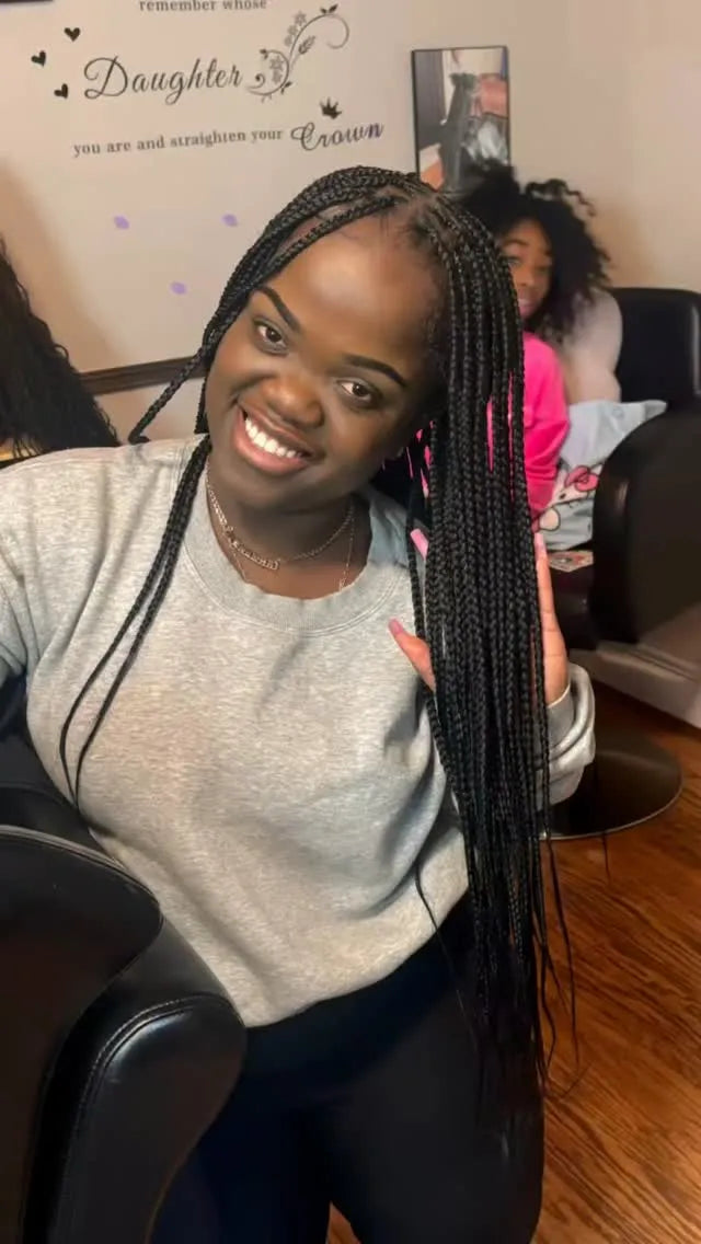 Long box braids styled to the side, hairstylist in Dover, DE