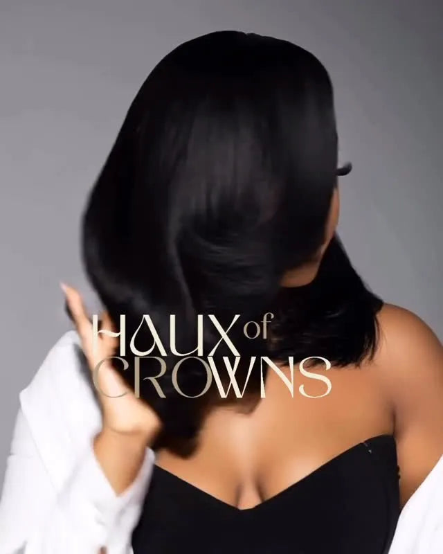 Sleek shoulder-length black bob with a dramatic side-swept bang and curled ends, hairstylist located in Clinton, MD