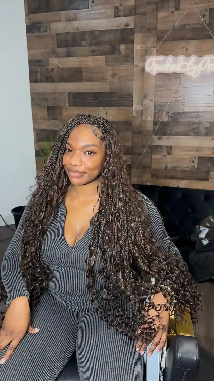 Extra-long dark brown boho knotless braids blended with loose spiral curls, hairstylist located in Fort Lauderdale, FL
