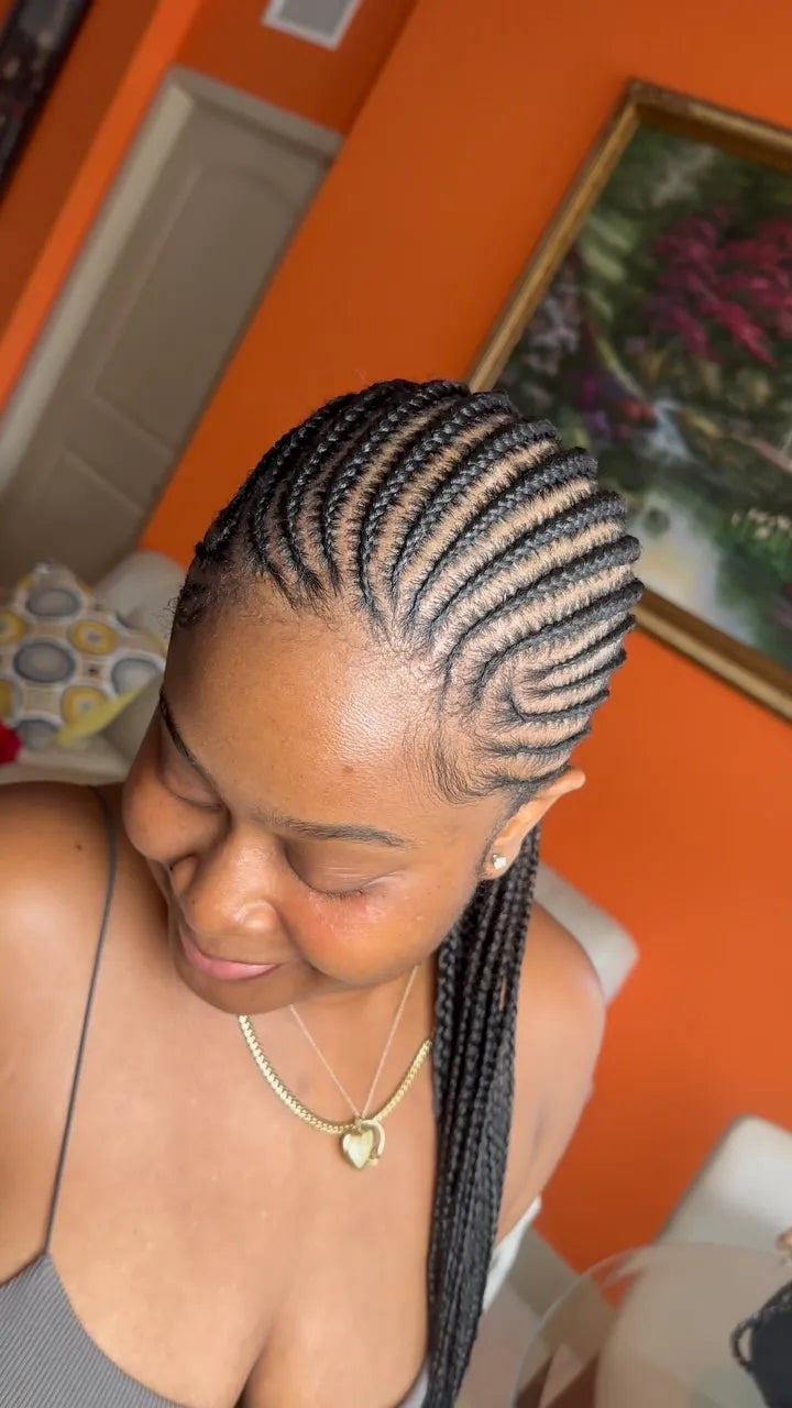 Side-swept caramel brown boho braids with voluminous curls and highlighted strands, hairstylist located in Fort Lauderdale, FL
