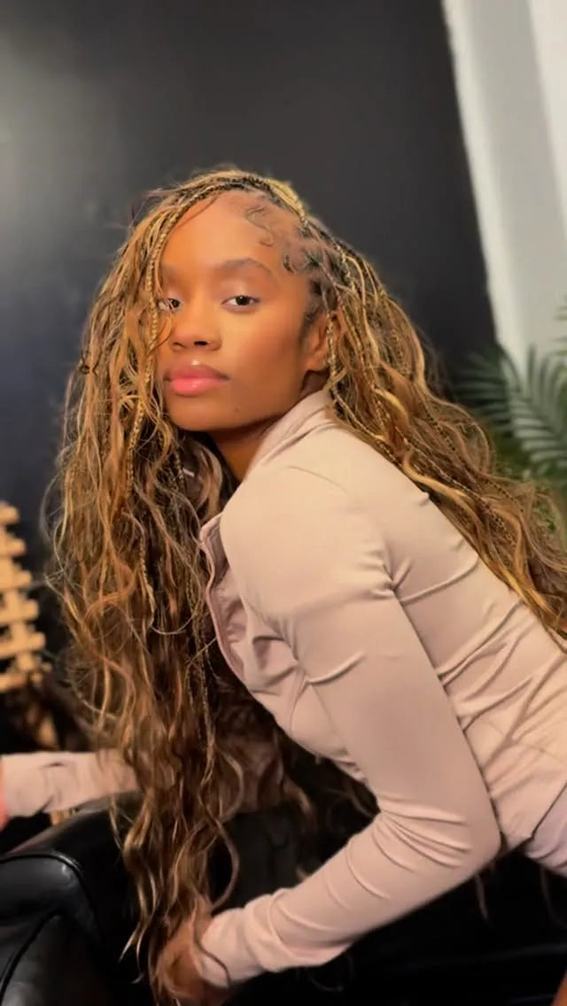 Long blonde boho braids with loose wavy pieces, hairstylist in Dallas, TX