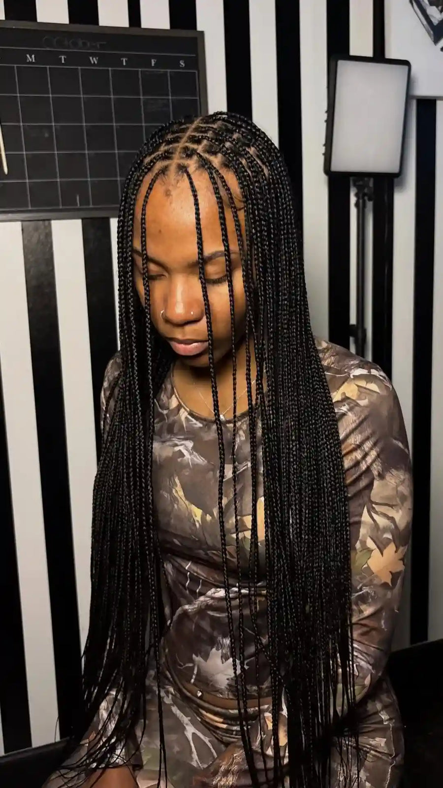 Long small knotless box braids with middle part, hairstylist in Dallas, TX