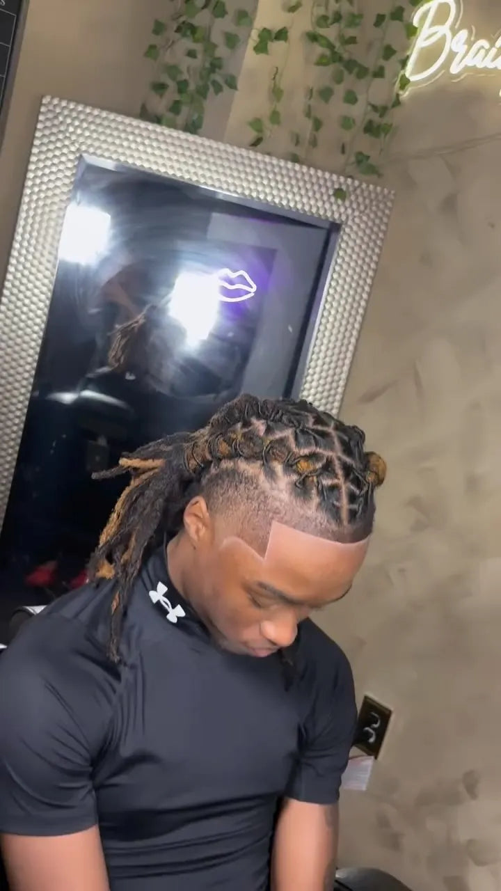 Men’s loc retwist with clean parts and tapered sides, hairstylist in Dallas, TX