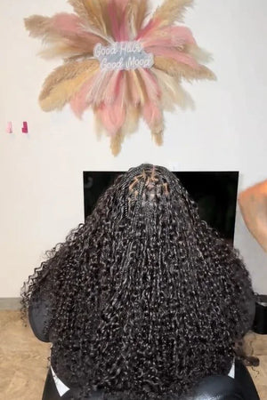 Tiktok influencer hername__long shows the braiding process of spanish curly braiding feather crochet hair
