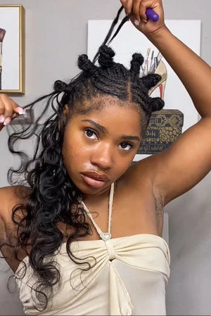 Tiktok influencer sunshineeefine shows the braiding process of body wave braiding feather crochet hair