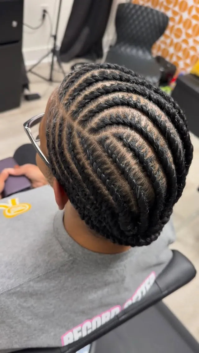 Feed-in cornrow braids with curved parting, hairstylist in Greensboro, NC