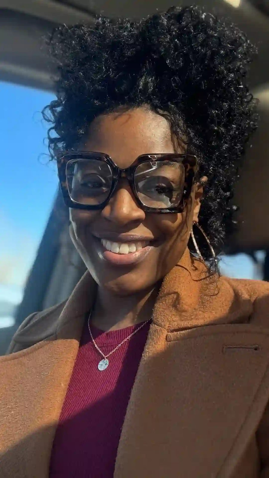 Natural curly updo with defined curls, hairstylist in Greensboro, NC