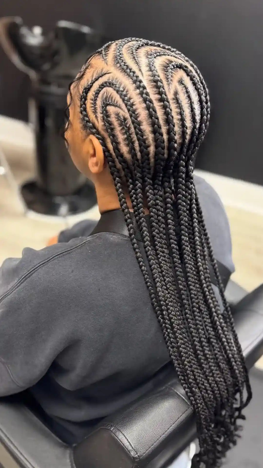 Long tribal braids with curved cornrow parting, hairstylist in Greensboro, NC