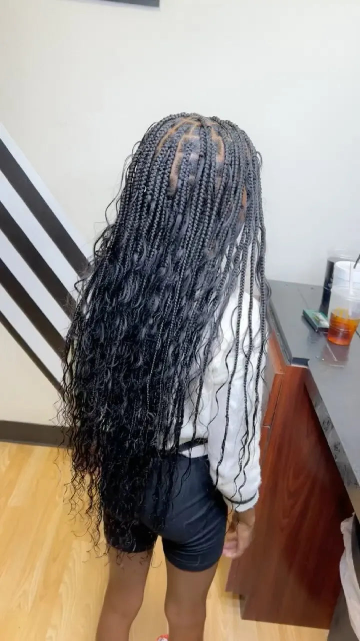 Long black boho knotless braids with loose wavy curls, hairstylist in College Station, TX