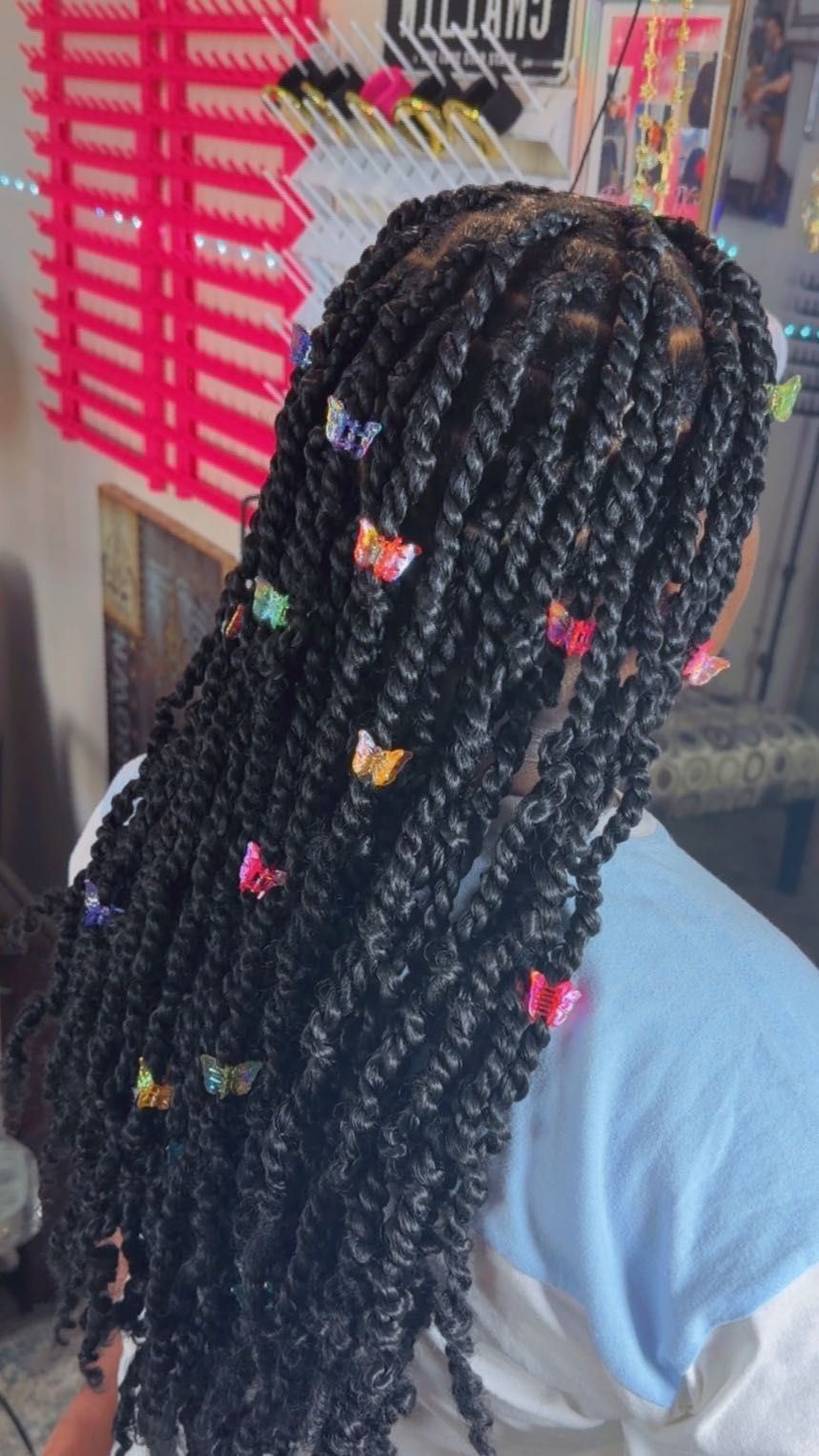 Kids box braids with curly ends and colorful butterfly clips, hairstylist in Texas City, TX