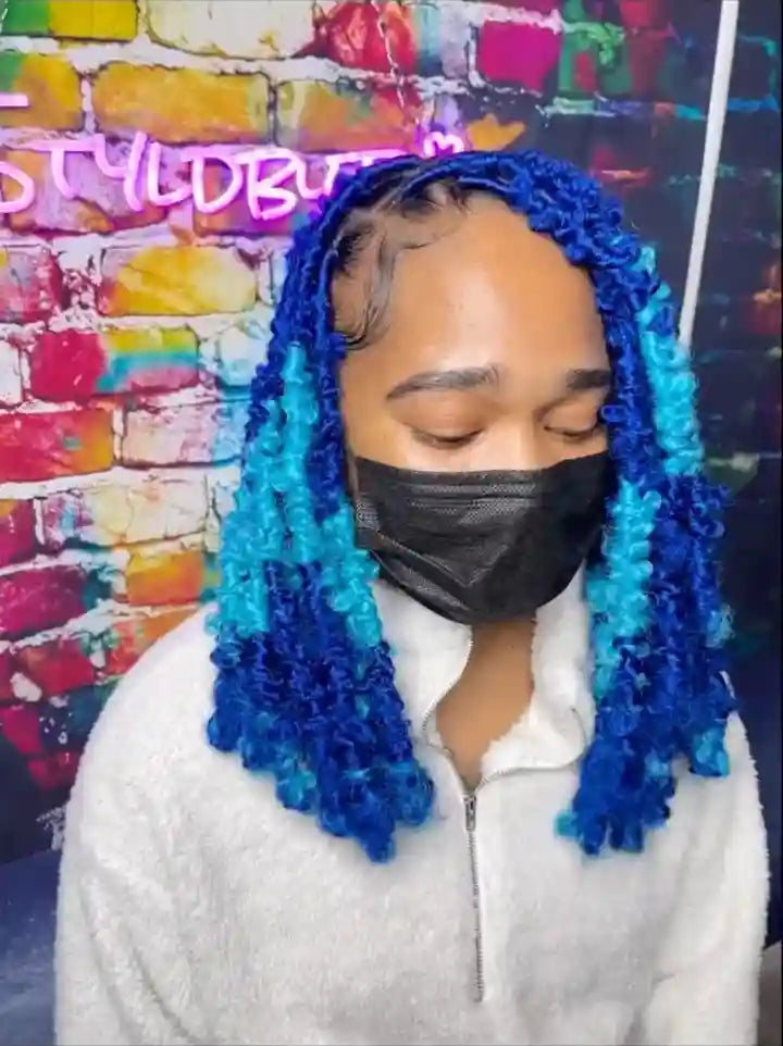Blue and teal butterfly locs with curly texture, hairstylist in Norfolk, VA