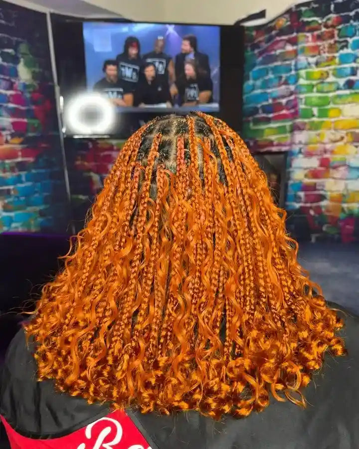 Orange boho knotless braids with curly ends, hairstylist in Norfolk, VA