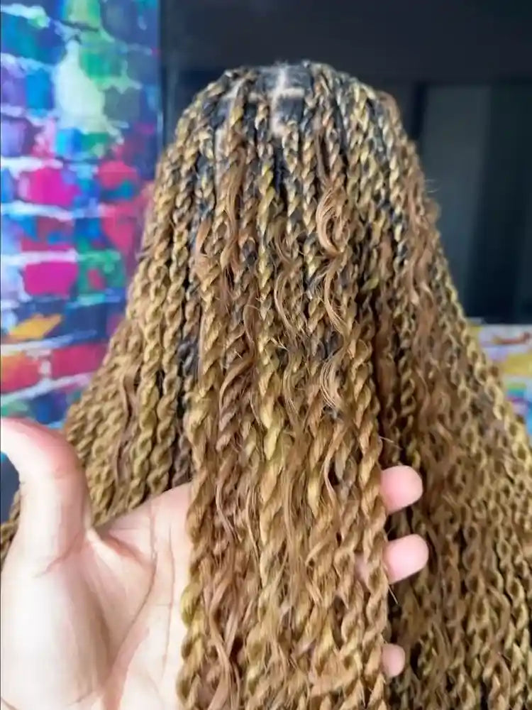 Blonde boho passion twists with loose curly pieces, hairstylist in Norfolk, VA