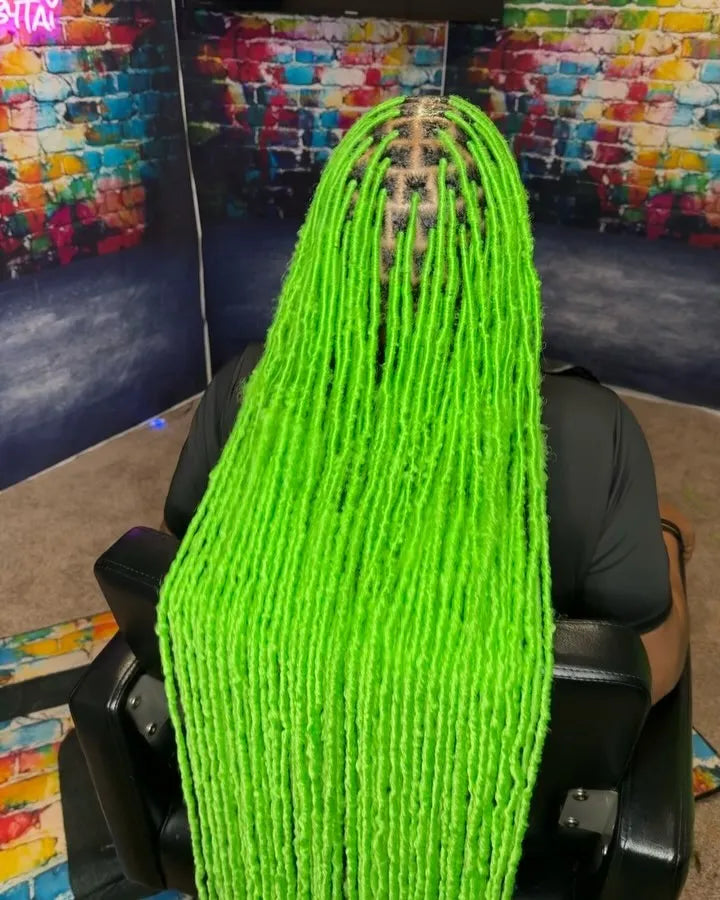Long neon green soft locs with clean parting, hairstylist in Norfolk, VA