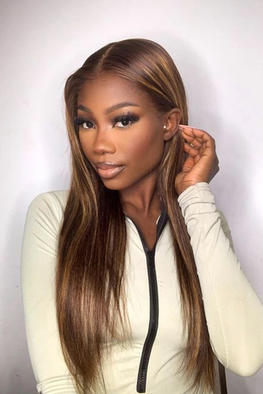 A model is showing off ygwigs' 5x5 HD lace closure brown with blonde highlights wig 1