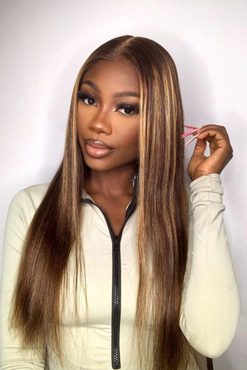 A model is showing off ygwigs' 5x5 HD lace closure brown with blonde highlights wig 2